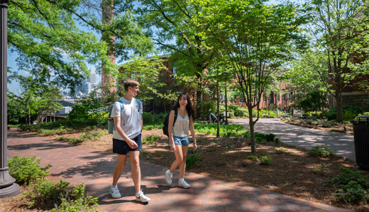 Two undergraduate students walk on Georgia Tech’s campus in Atlanta, Georgia.